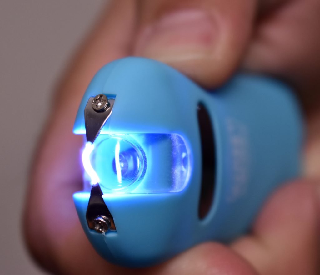 Streetwise 24M SMART Keychain Stun Gun - Teal, in hand up close