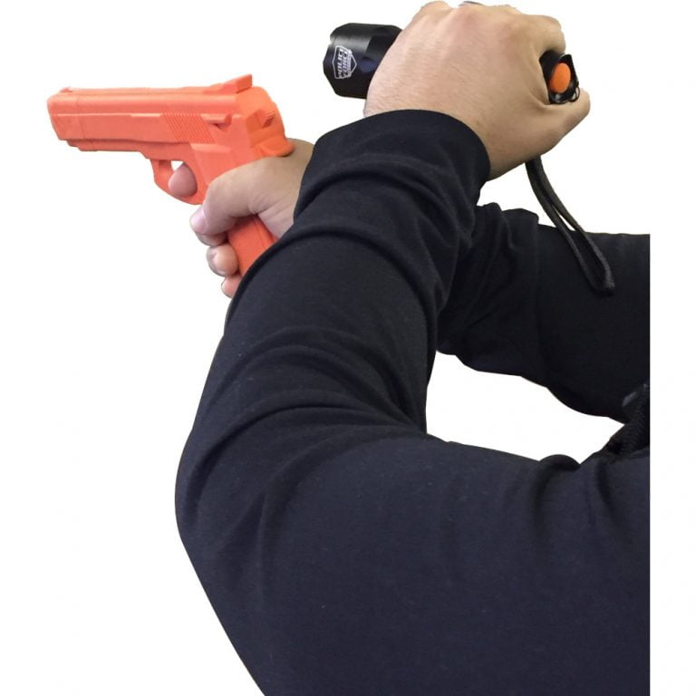 Police Force L2 LED Flashlight in hand w/ gun