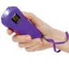 Trigger Stun Gun Flashlight purple in hand